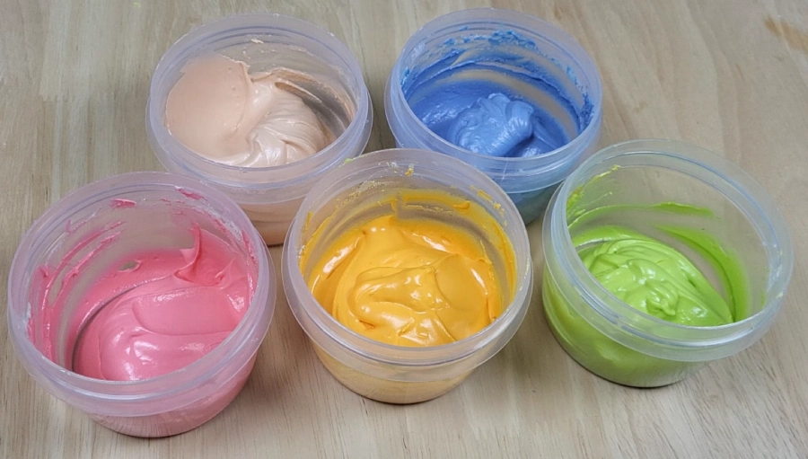 Mixing basic gel colors to create different royal icing shades
