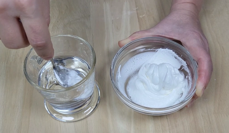 Adding small amounts of water to adjust royal icing consistency