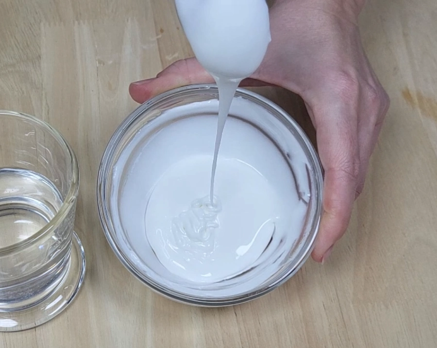 Royal icing flood consistency flowing in a thin stream