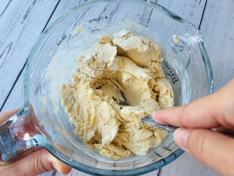Sugar cookie dough coming together after flour addition