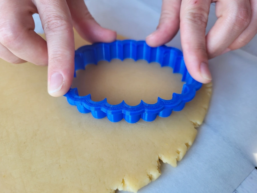 Cutting sugar cookie shapes from rolled dough